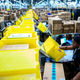 Illustration for article titled Amazon Institutes New ‘Hero Tax’ Charging Essential Workers Additional $2 Per Hour For Honor Of Bravely Performing Job